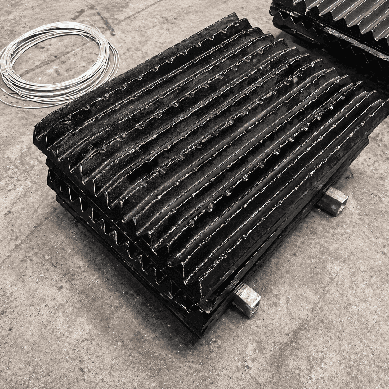 Crusher jaw plate wear part for heavy-duty crushing applications.
