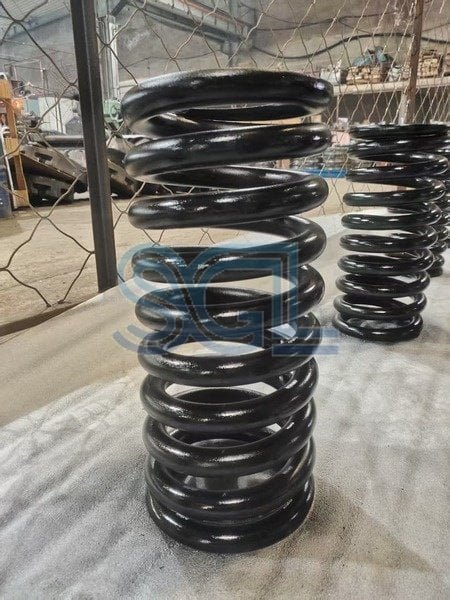 Industrial vehicle suspension coil springs for heavy-duty applications.