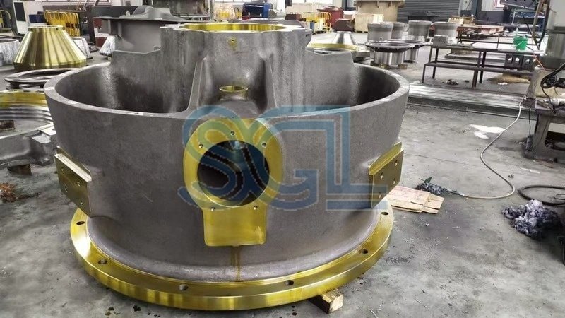 Industrial bearing housing for crusher and heavy machinery use.