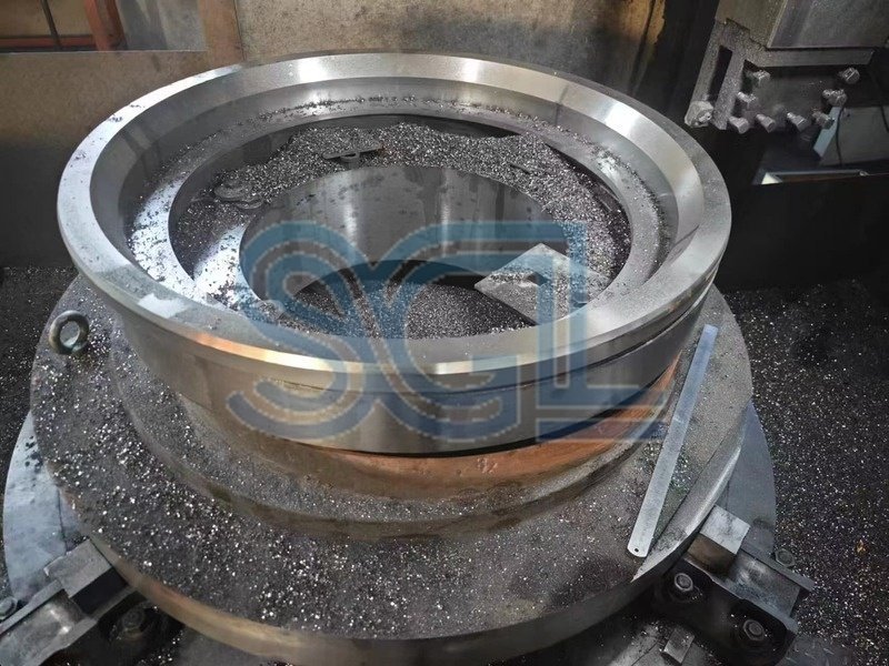 Machined crusher component for heavy-duty replacement and maintenance.